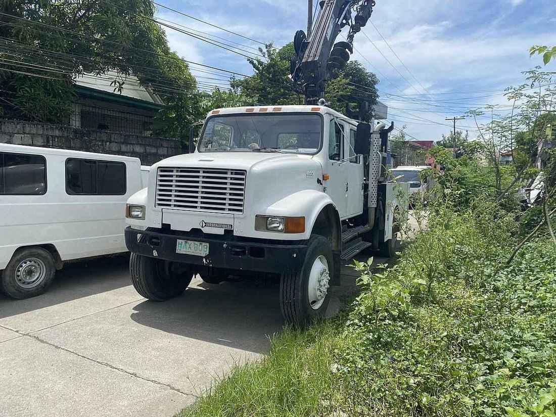 Utility crew work — illustrative of transmission/generation buildout, not Schahfer or Hobart
