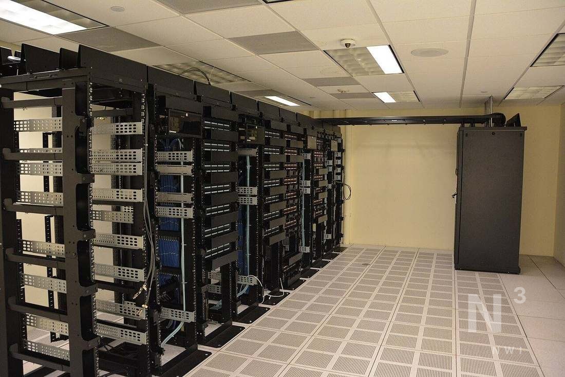 Rows of server racks inside a data center — illustrative of hyperscale load tied to NIPSCO GenCo’s Amazon power deal.