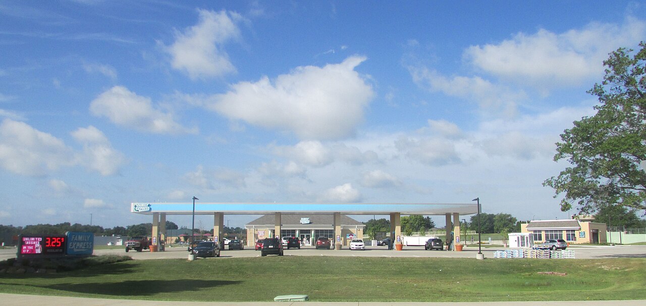 A Family Express fuel station in Valparaiso, Indiana, with a light blue canopy over the pumps and a sign showing gas at $3.25
