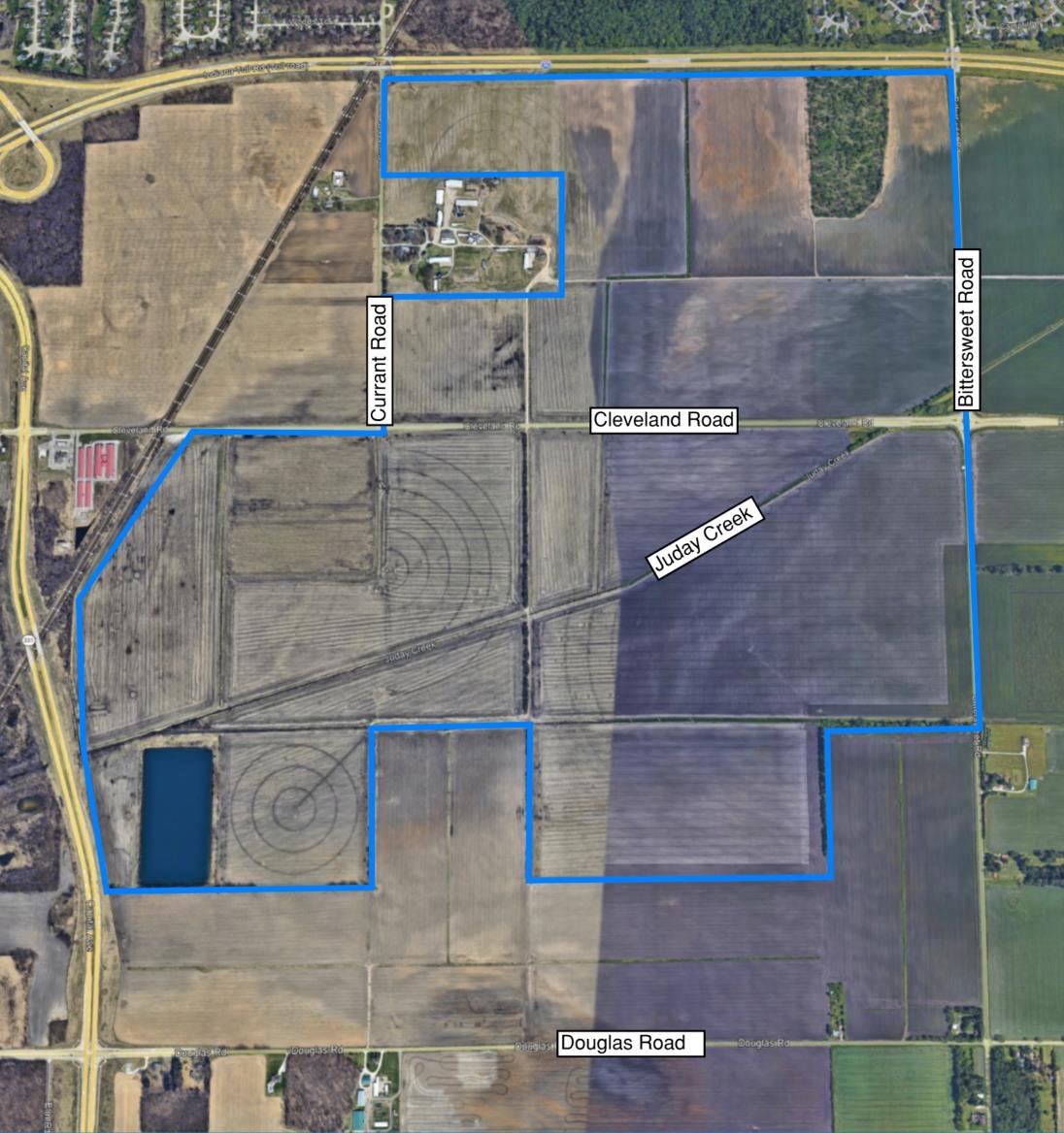 Microsoft site map outlining its Granger property in blue along Bittersweet Road south of the Indiana Toll Road, with Cleveland Road and Juday Creek crossing the site