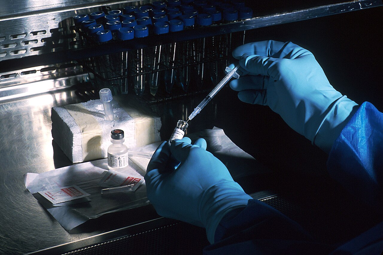 File photo: A National Cancer Institute scientist prepares an experimental cancer vaccine, 1993.