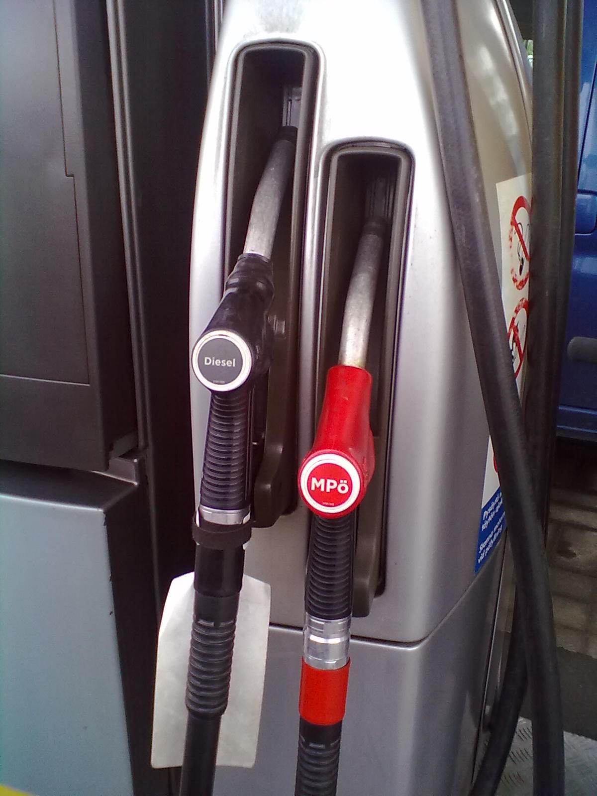 File photo: Diesel and motor-oil pump nozzles at a service-station fuel pump.