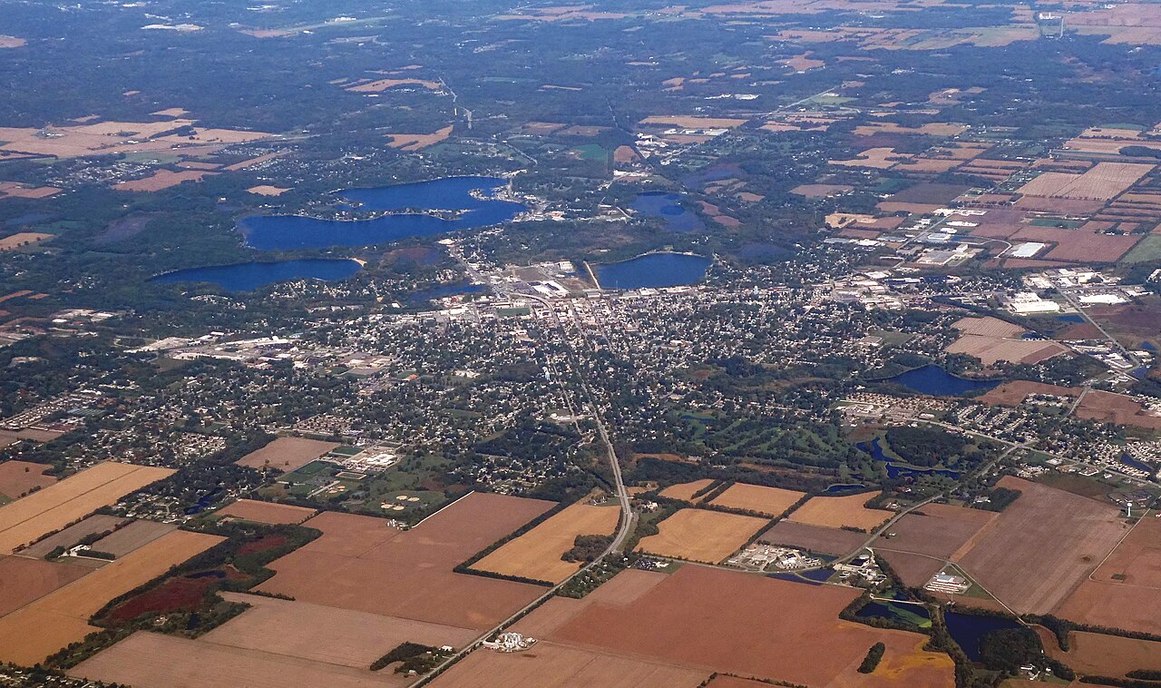 Aerial view of the city of La Porte, Indiana, with autumn trees and downtown streets.