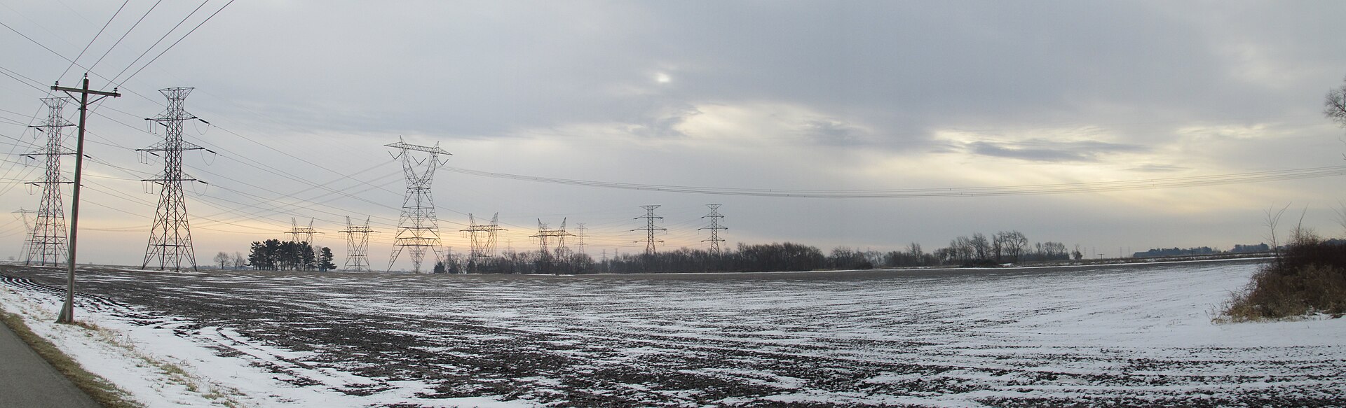 NIPSCO transmission towers and power lines crossing a snow-dusted farm field near Malden in Porter County.